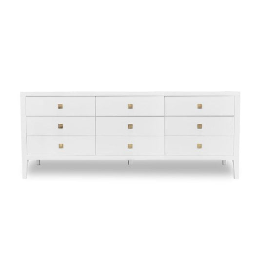 A white 9-drawer dresser with small square gold pull handles and tapered legs.