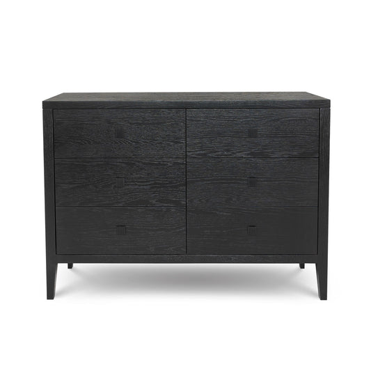 A black wood dresser with six drawers, featuring a textured grain finish and minimalist square pull handles.